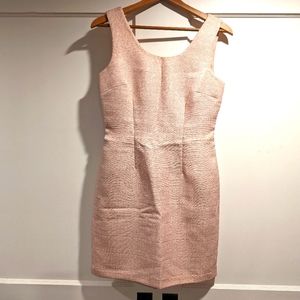 Sleeveless, light pink tweed fitted dress.